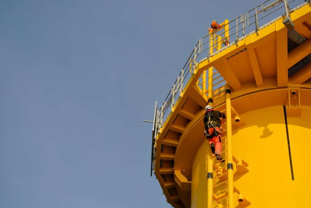 Gwo-certified,Offshore,Technician,Rigger,Climbing,Wind,Turbine,Foundation,Ladder,Wearing